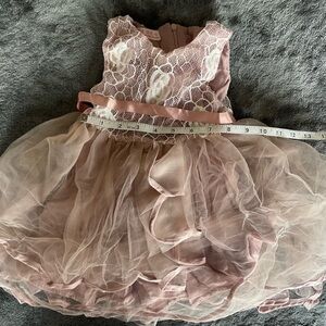 Beautiful lace tutu dress for girls size 12M, has a stain
